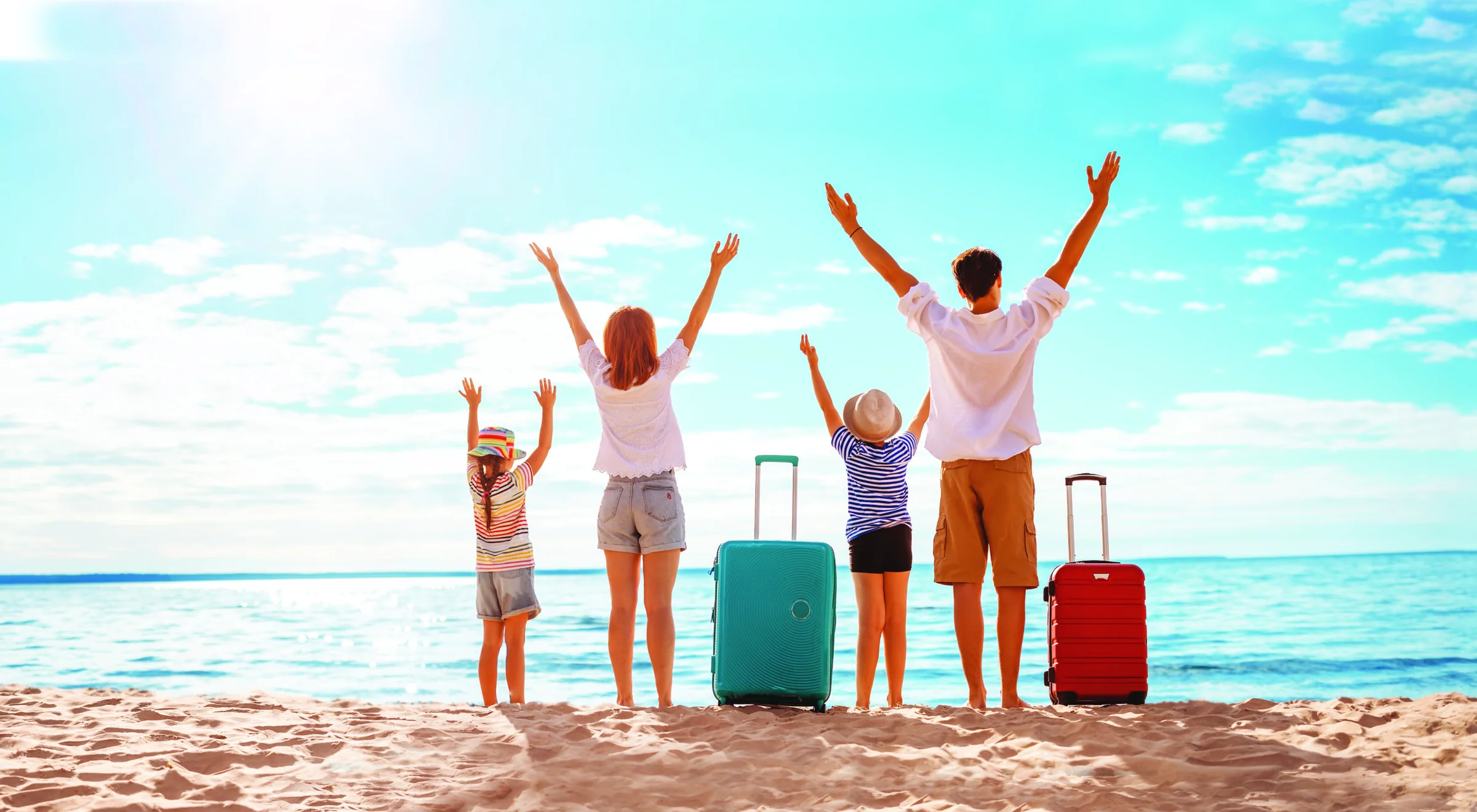 Family arriving on a tropical beach
